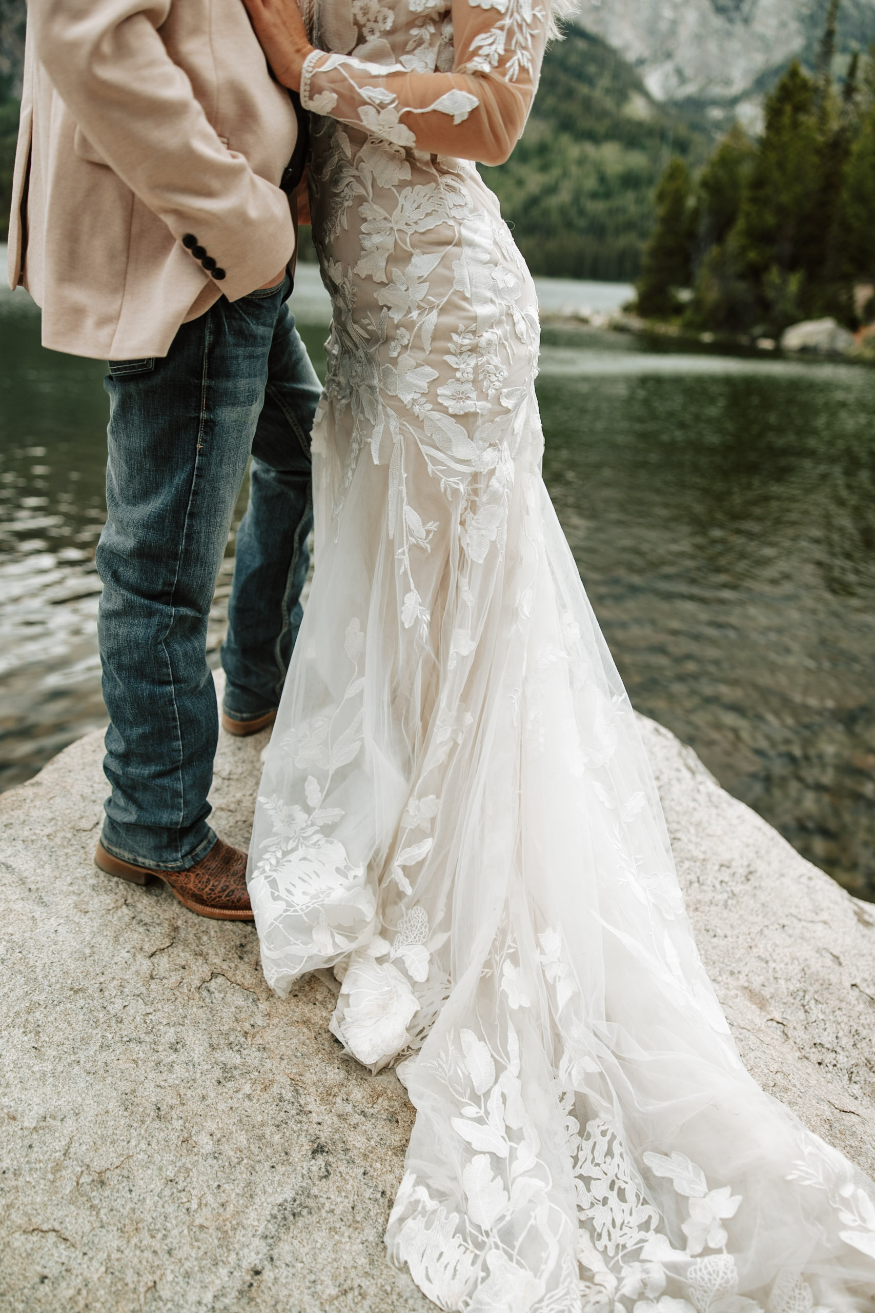 White wedding dress on a rock